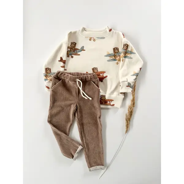 KOMPLET BLUZA PRĄŻKOWANA ODLOTOWE MISIE + JOGGERY SZTRUKSOWE Z KIESZONKAMI NOUGAT